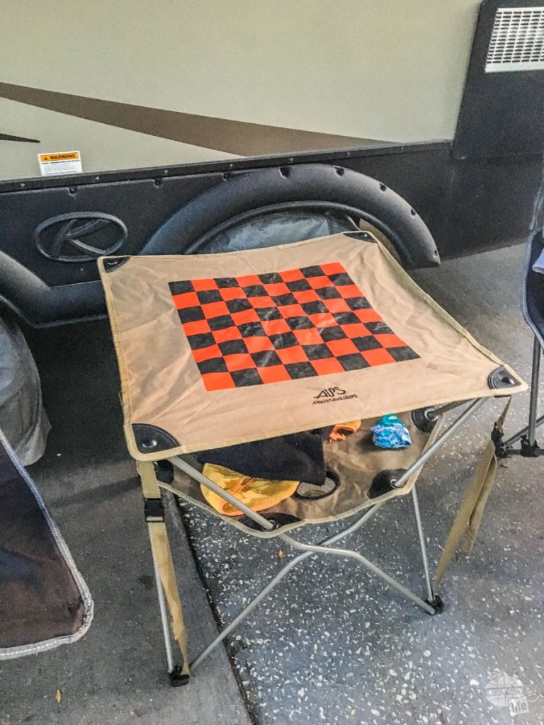 Camp table with checker board