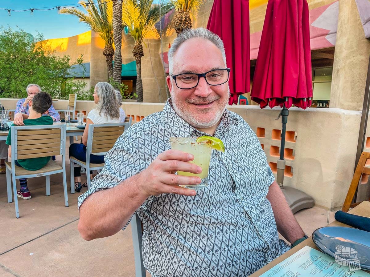 Grant poses with a margarita.