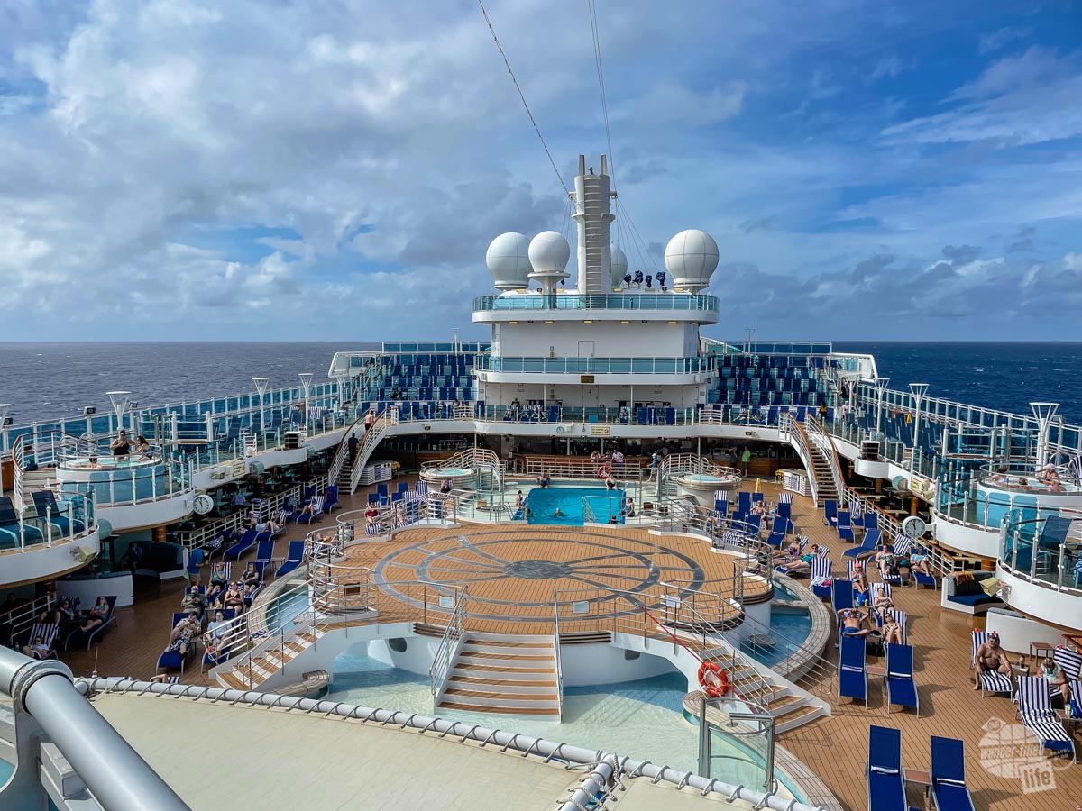 A nearly empty pool deck on a cruise ship.