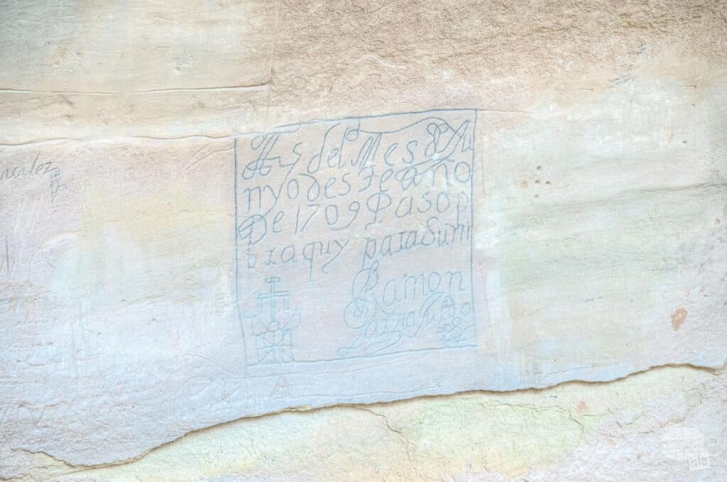 An inscription carved into a sandstone rock at El Morro National Monument.