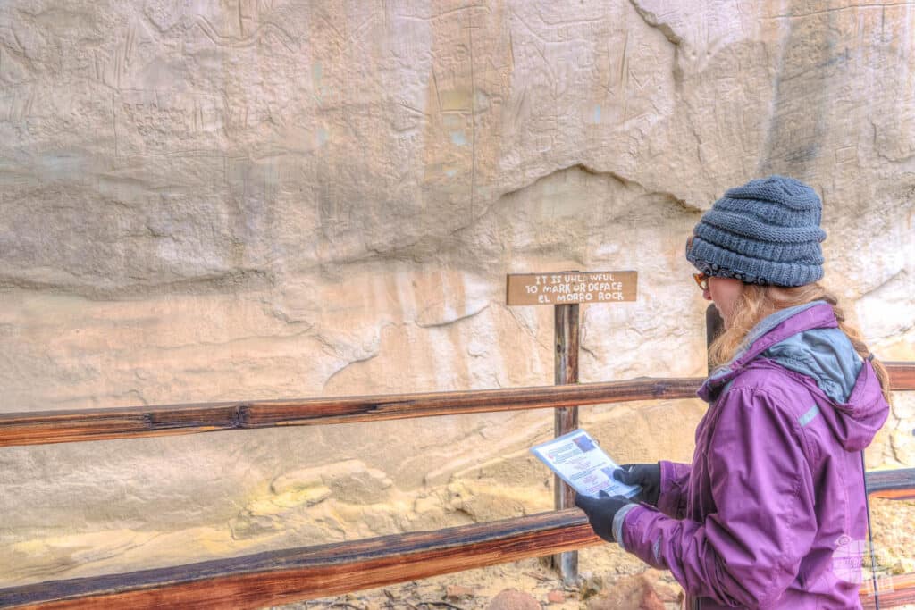 Bonnie reading up on on of the names carved into Inscription Rock.
