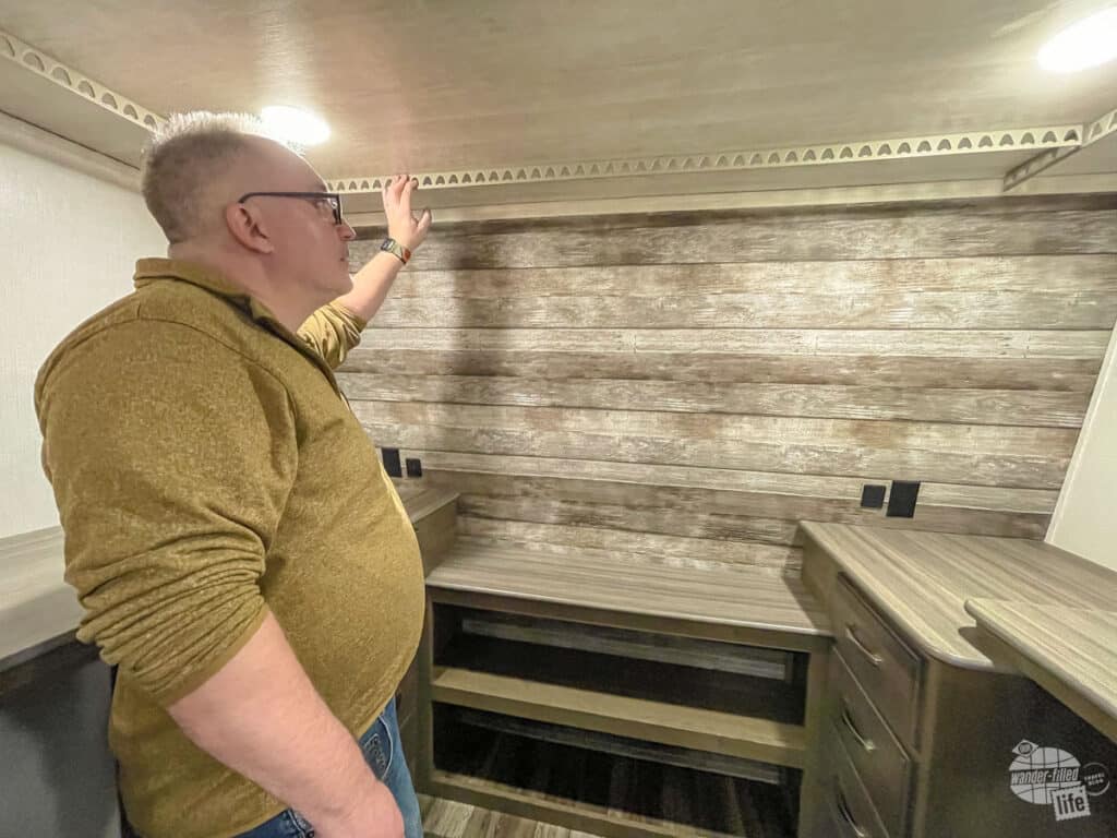 Grant looking at the walk-in closet in an RV.