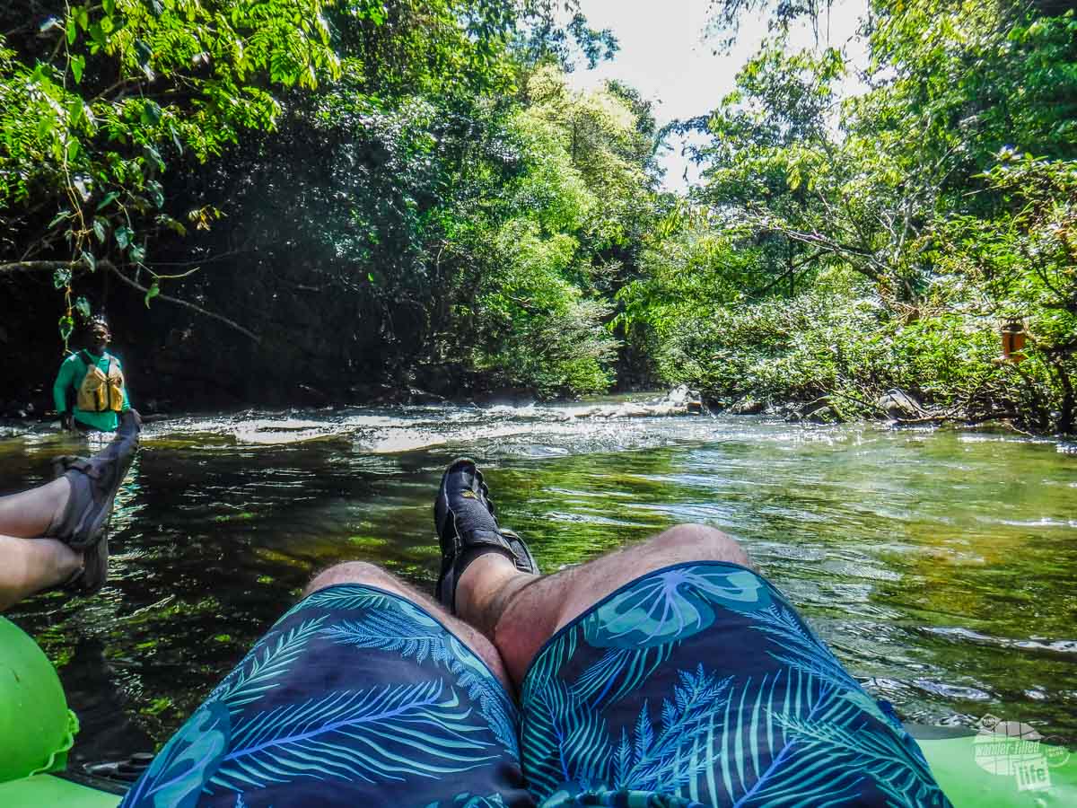 Relaxing on the river in Belize on the Rainforest River Tubing excursion.