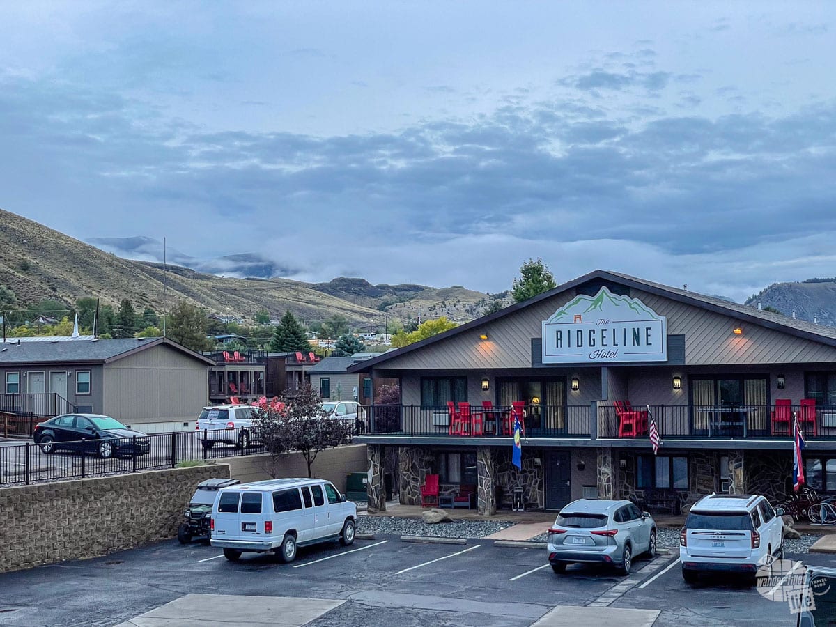 The Ridgeline Hotel with a backdrop of mountains. 