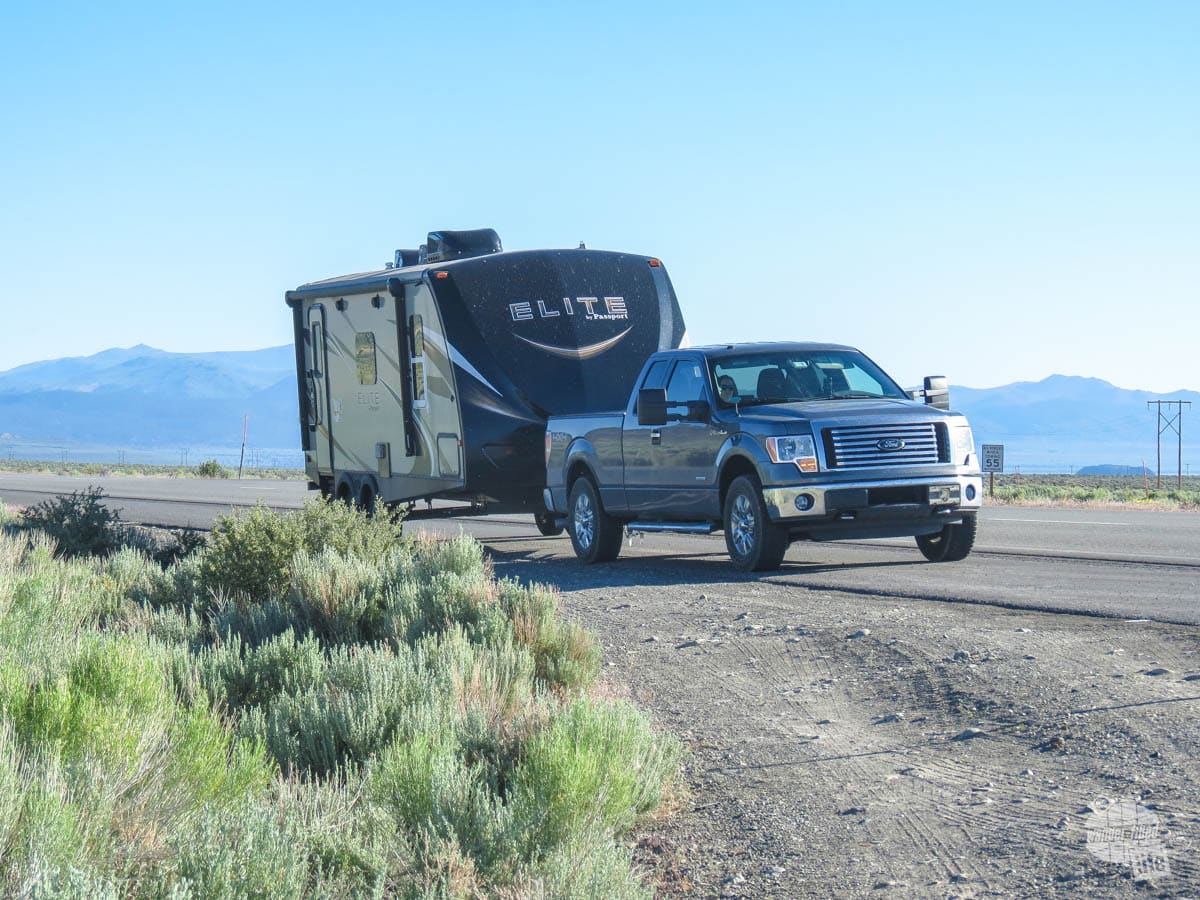 Our truck towing our camper along the highway in eastern California.