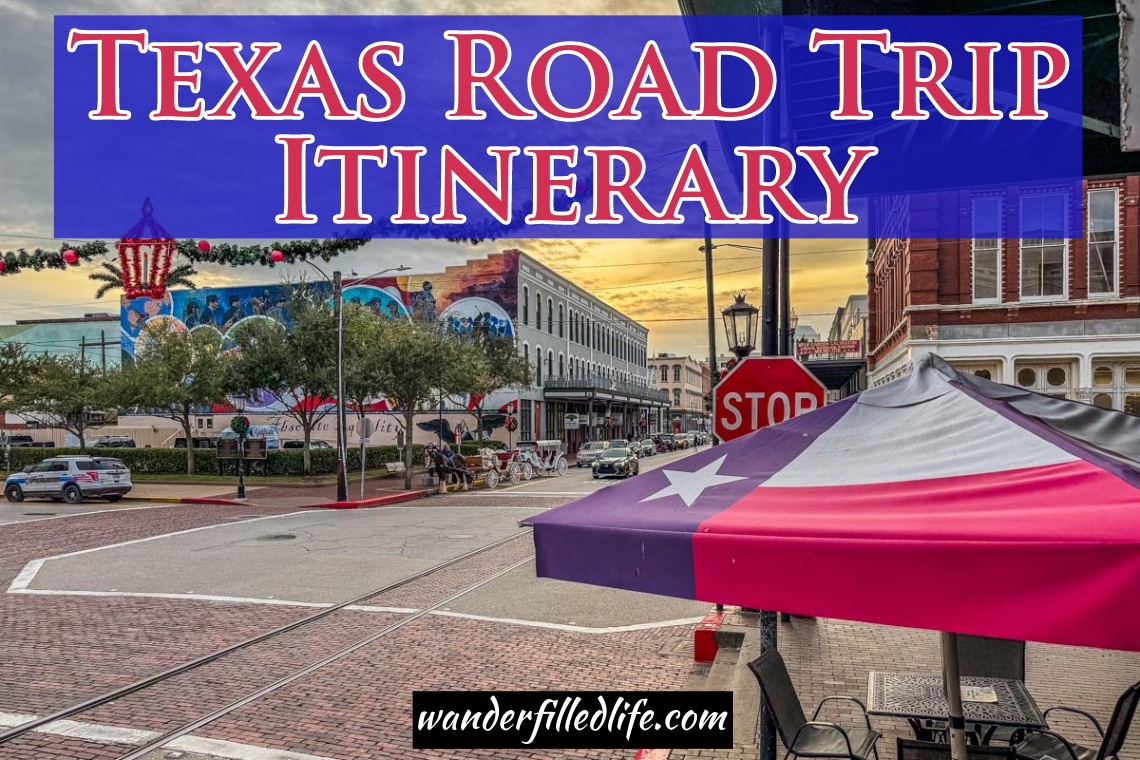Image with text overlay for Pinterest. The image shows a city street with a table awning in the likeness of the Texas Flag - a single white star on a blue background and red and white stripes. The text at the top of the page reads 9 Day Texas Road Trip Itinerary.