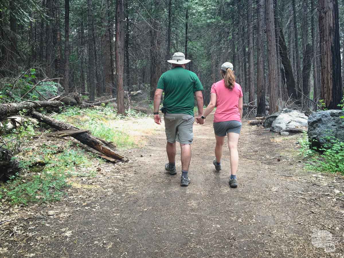 Grant and Bonnie Sinclair walking on the Valley Loop Trail in Yosemite National Park, California.