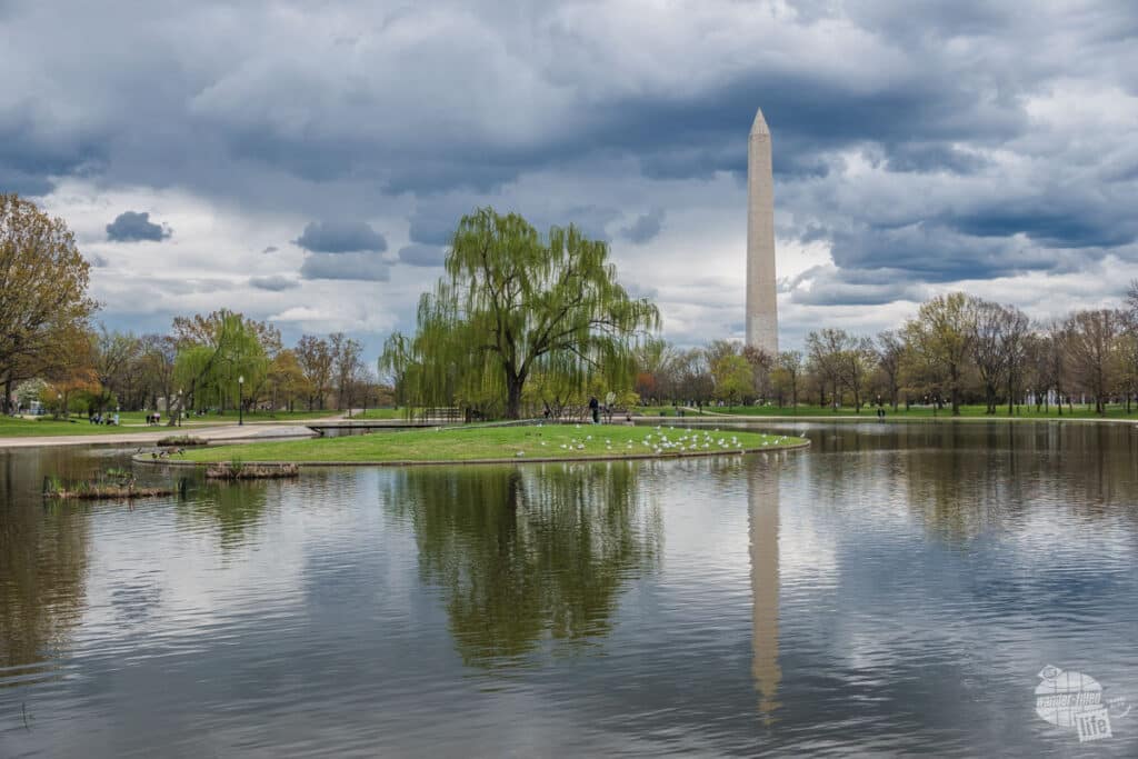 The Washington Monument reflected in the waters of the pond which surrounds Constitution Gardens.