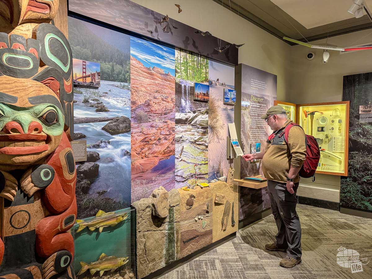 Grant views an exhibit on the different landscapes of the national parks.
