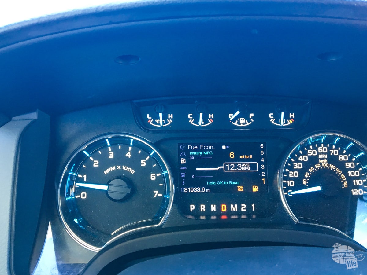 The dash of a truck with the informational display indicating six miles to empty.