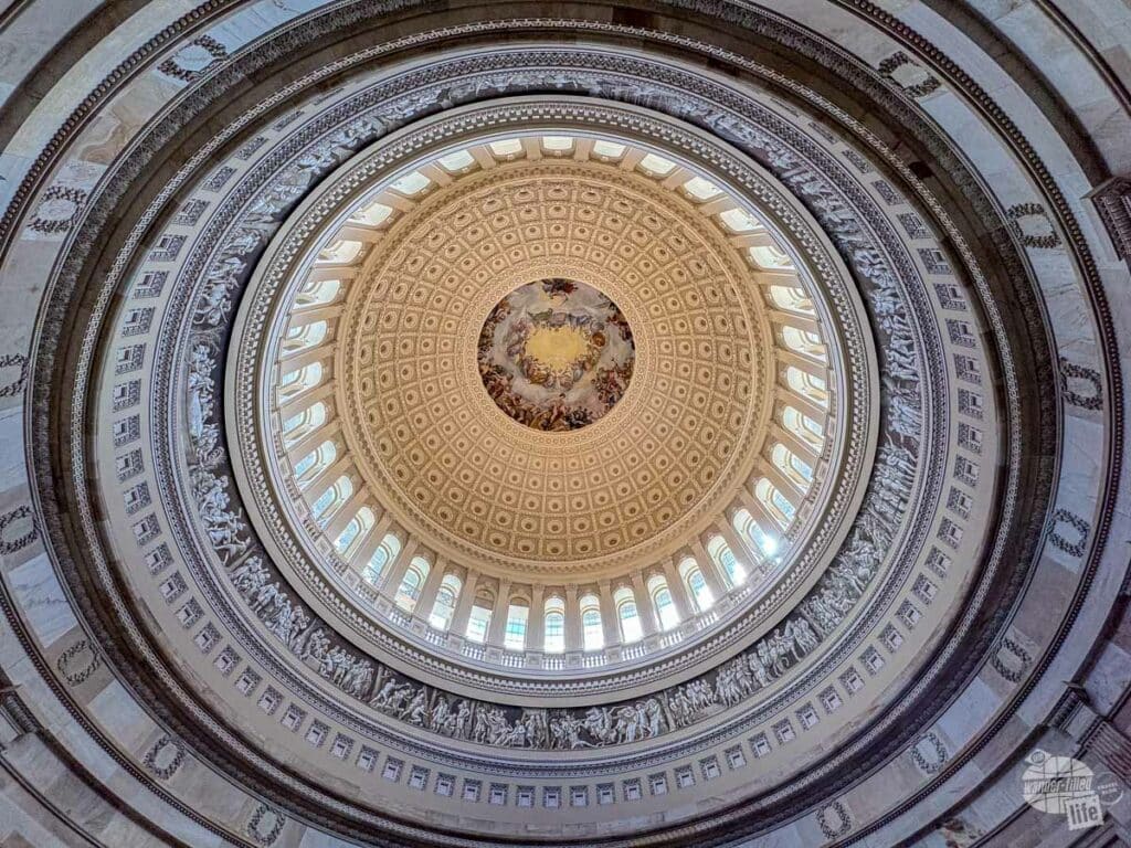 A picture of a fresco at the top of the inside of the Capitol Dome.